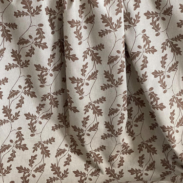 Beige cotton-linen upholstery fabric with botanical oak leaf and acorn pattern – perfect for custom blinds, drapes, and cottage-style interiors